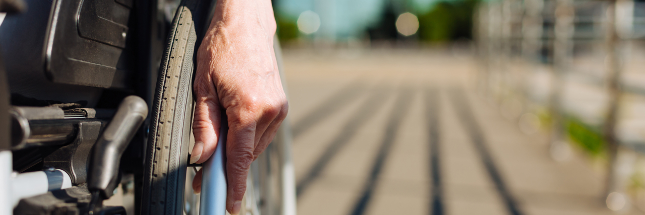 Please Think Before Asking Someone a Question About Their Disability Aged strong lady rolling the wheelchair