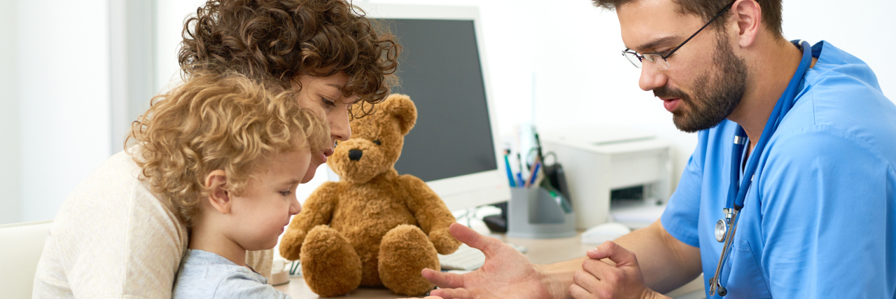 The Medical Community Needs to Listen to Their Patients' Stories doctor talking to a mother and her son