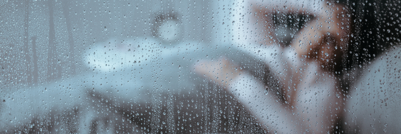 When Illness Means You Can't Do Anything woman lying in bed on a rainy day