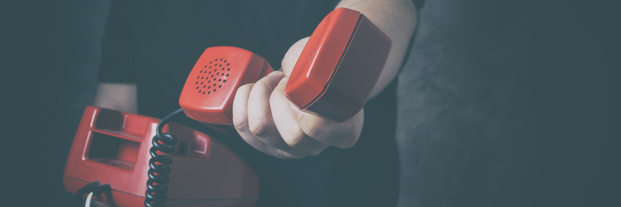 New Bill Proposes Changes to the National Suicide Prevention Lifeline red phone