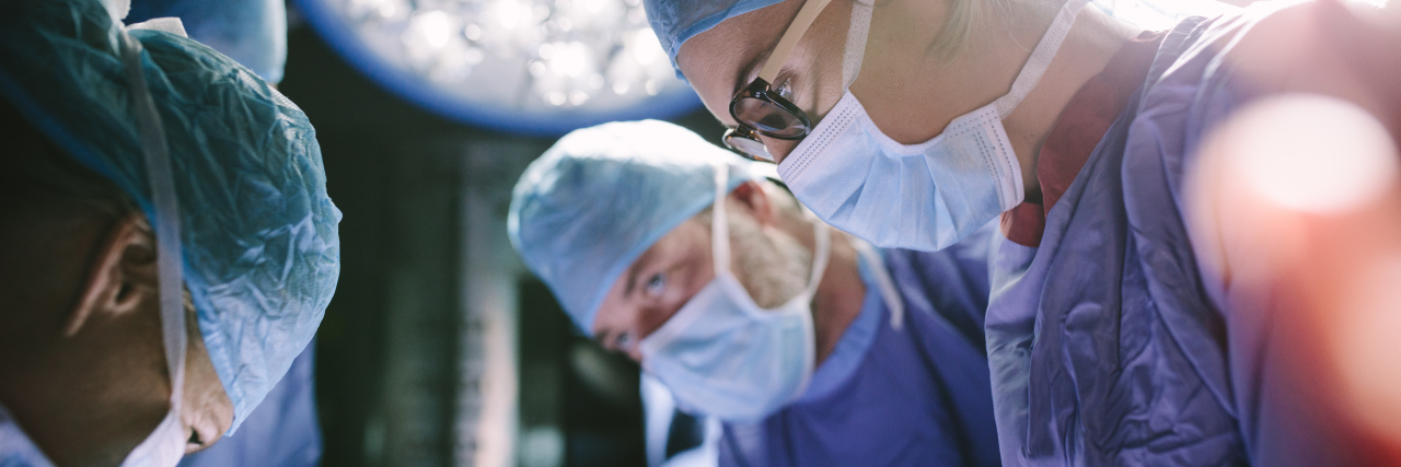 Harassed At Work Because of My Autism Surgeon performing surgery with her team.