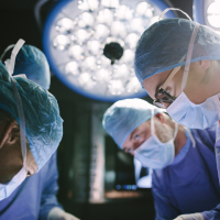 Surgeon performing surgery with her team.