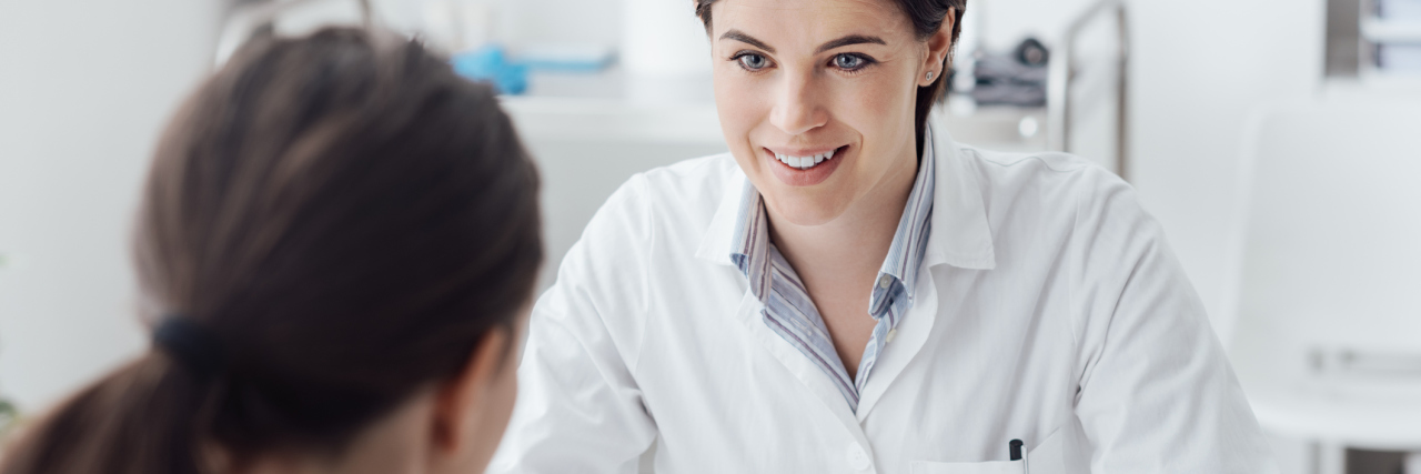 female doctor talking with her patient