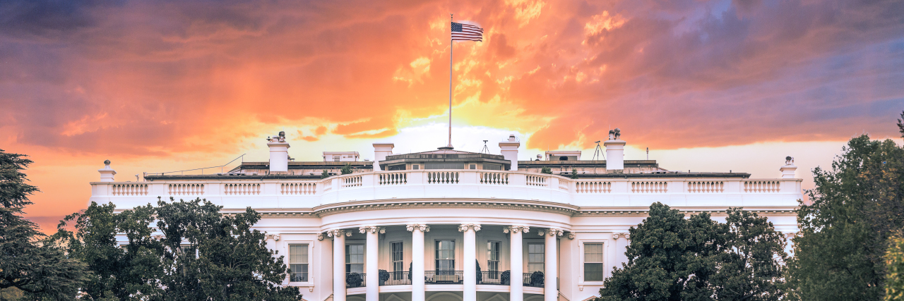 White House, under dramatic sky.
