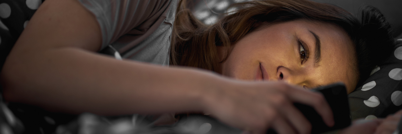 My Anxiety Keeps Me Up at Night girl texting in bed