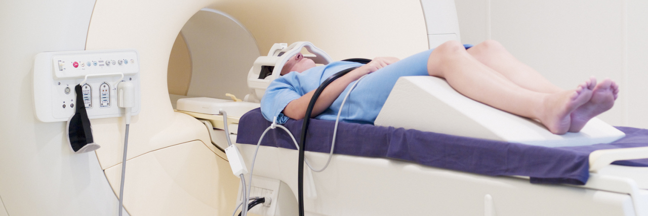 When It's Time to Get an MRI A woman going into an MRI machine.
