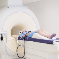 A woman going into an MRI machine.