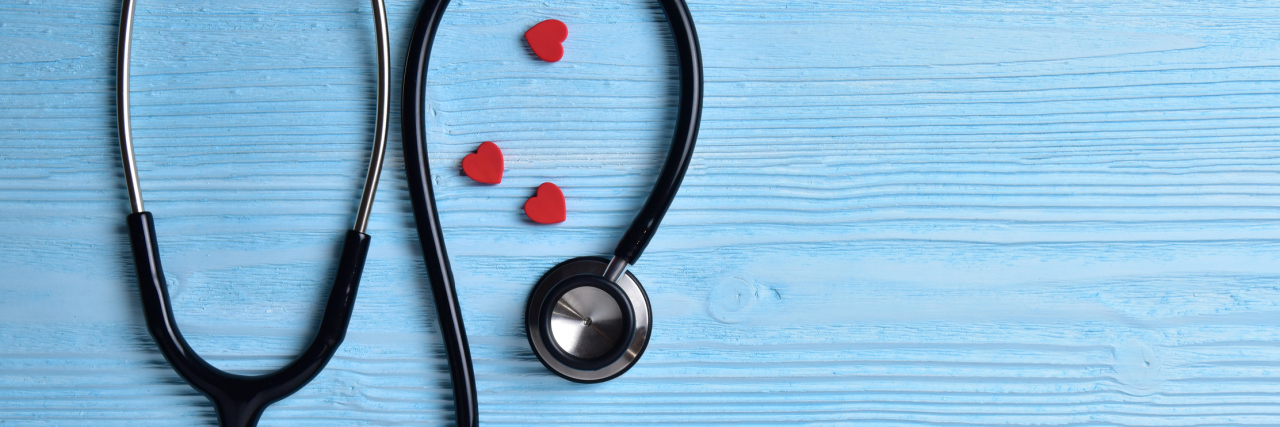 What Doctors Should Know About Patients With Invisible Chronic Illness stethoscope lying on a blue table