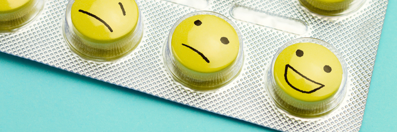 a packet of pills with faces written on them