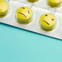 a packet of pills with faces written on them