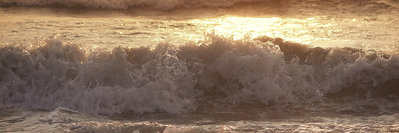 Stuttering Doesn't Define Me Rough waves with view of sunset.