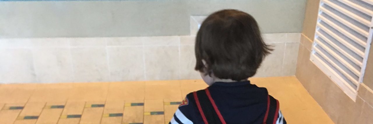 Hearing My Son Say 'Don't Worry, You Can't Catch What I Have' little boy with walker near a pool