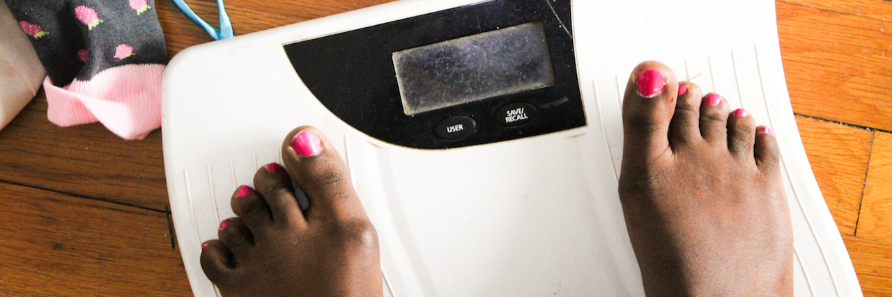Black Girls Get Eating Disorders, Too A woman's feet on a scale