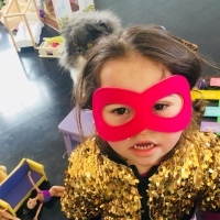Girl with Down syndrome wearing a mask