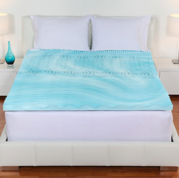 blue foam mattress topper on bed