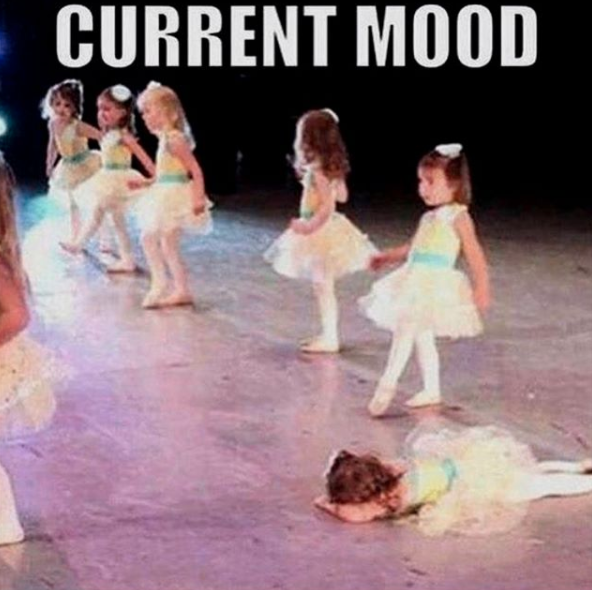 girls doing ballet performance, one girl is lying facedown on stage. caption current mood