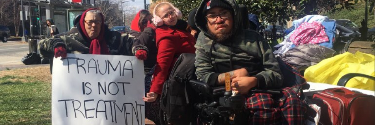 ADAPT Protests FDA Commissioner Lack of Action on Shock Devices ADAPT members protesting outside FDA Commissioner's residence