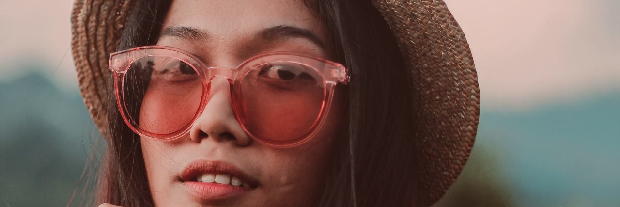 I Didn't Think I Had ADHD Because I Get Good Grades woman with sunglasses and a hat