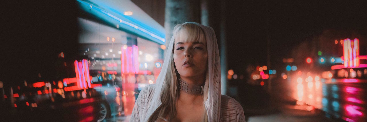 To the People Who Tell Me to Stop Calling Myself a 'Victim' woman neon lights