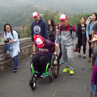 Kuen rolling along the Great Wall of China.