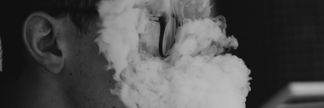 I’m Bipolar and I Don’t Want to Be Cured A man with smoke in his face.