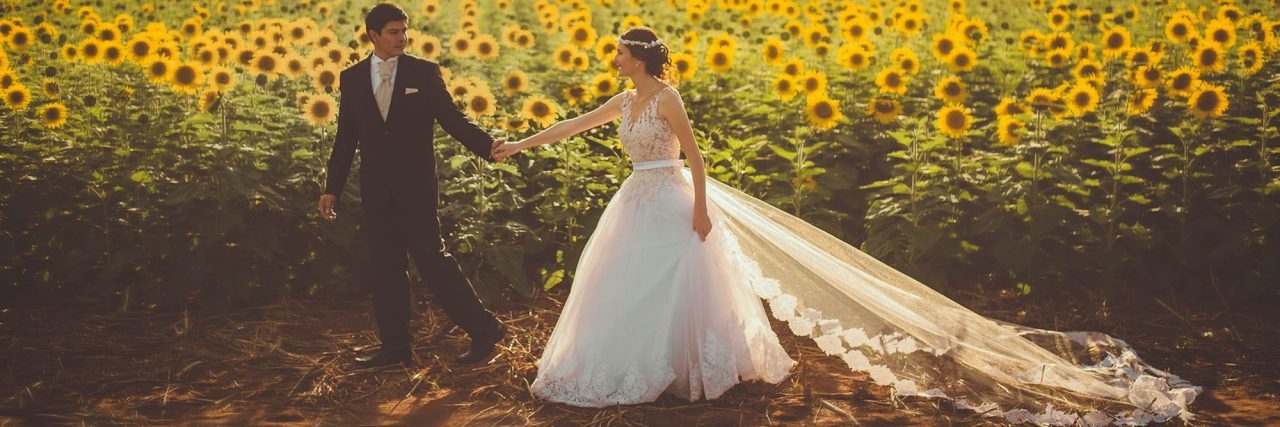 Soon-to-Be Husband: What to Know About My Depression newly married couple in front of field of sunflowers