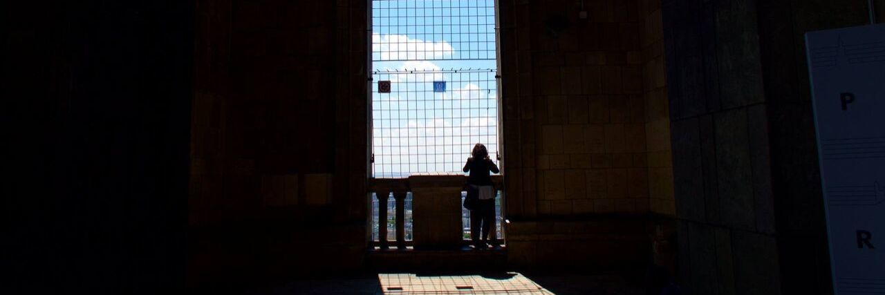 The author standing in the shade, and the shadow of a window being cast