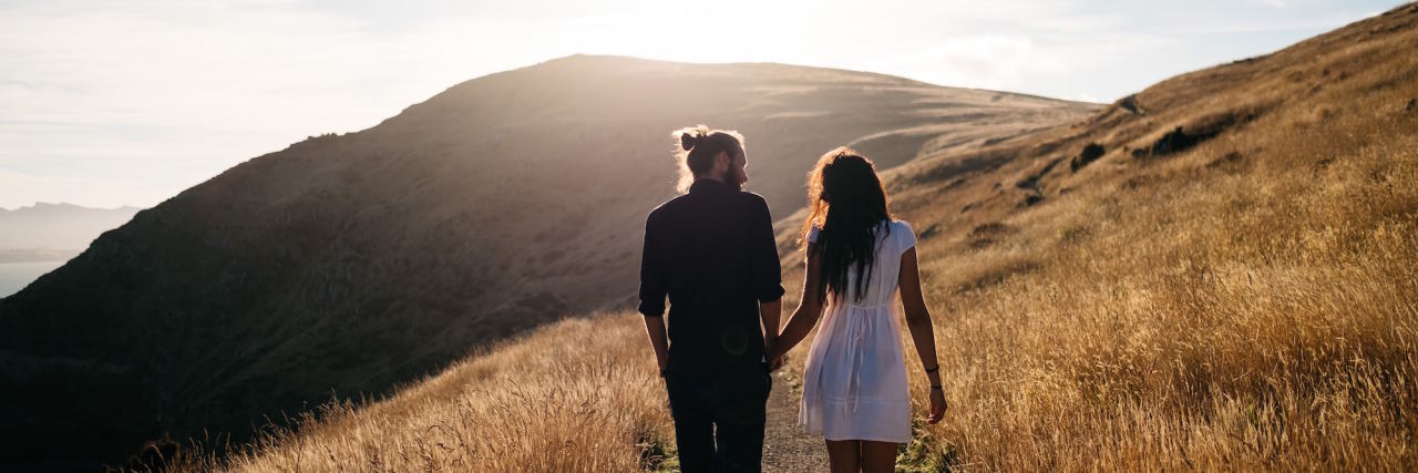 What It's Like to Fall in Love With Someone With Anxiety couple holding hands