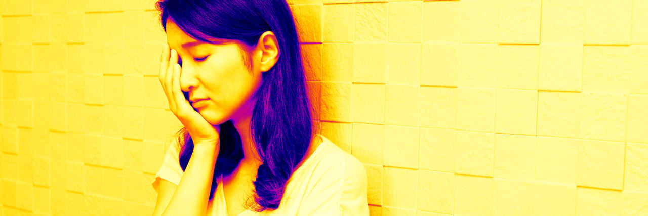 What 'Comparison Is the Thief of Joy' Means to Someone With Depression woman head in hands