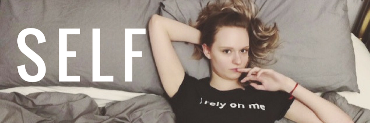 woman lying in bed wearing a shirt that says 'I rely on me' with a caption on the photo that reads 'self advocacy'