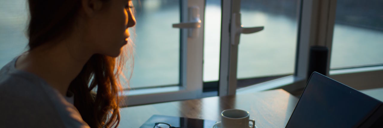 4 Tips for Writing a Realistic Character With Depression woman typing