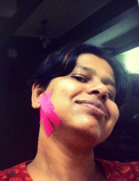 woman with pink kinesio tape on her jaw