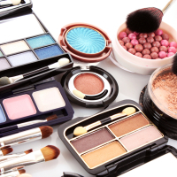 closeup photo of colorful eyeshadow, blush and other makeup products