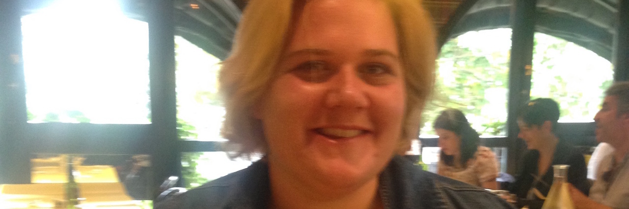 Living With Schizoaffective Disorder in the World of Academia A man sitting at a table