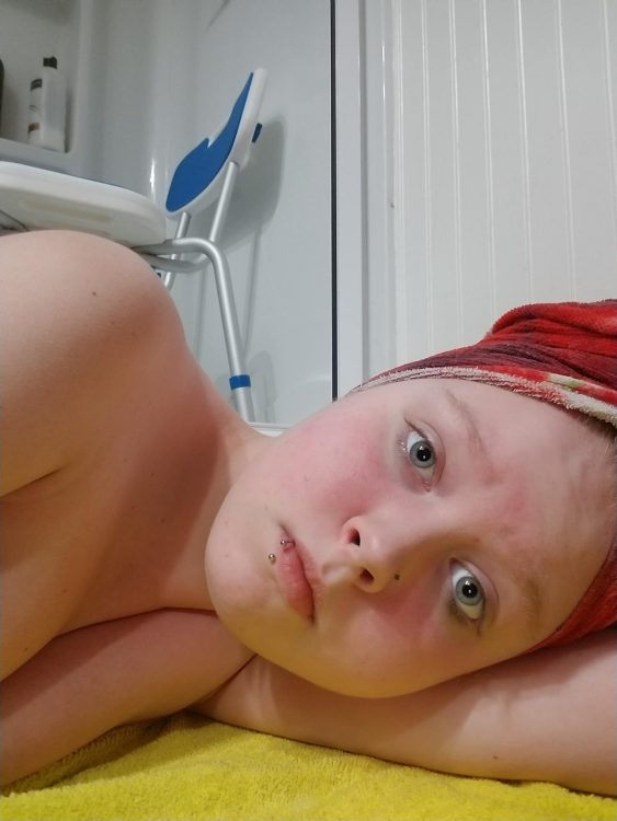 girl laying on floor after shower