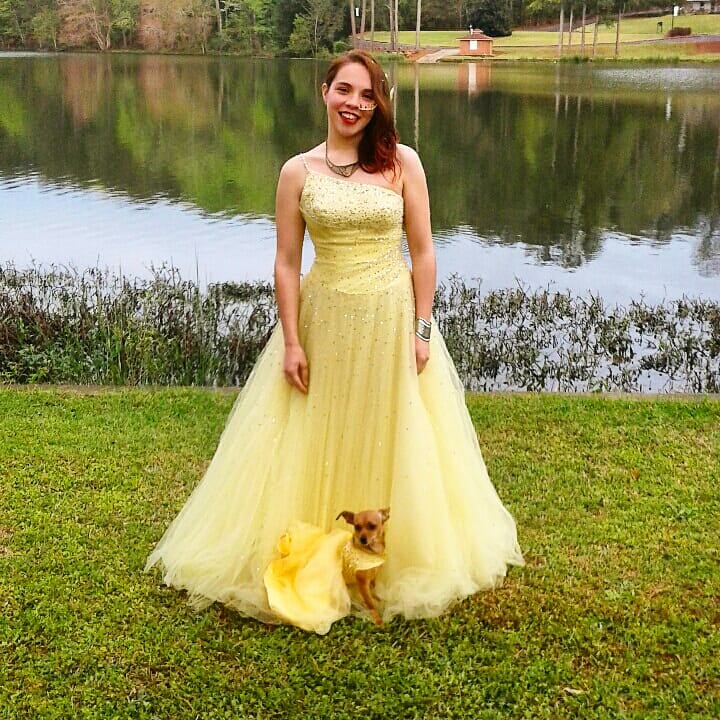woman wearing yellow dress with dog in matching dress