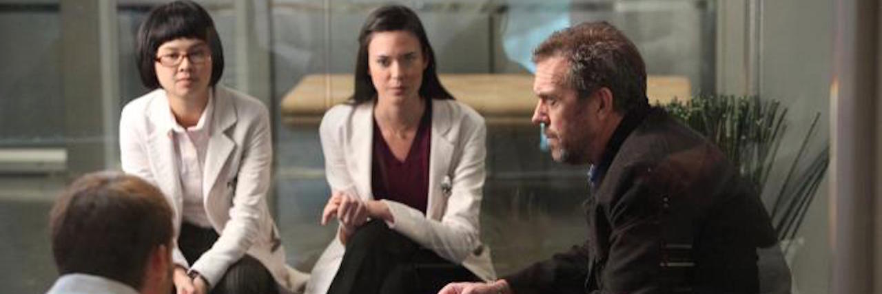 A photo of the doctors on "House" talking.