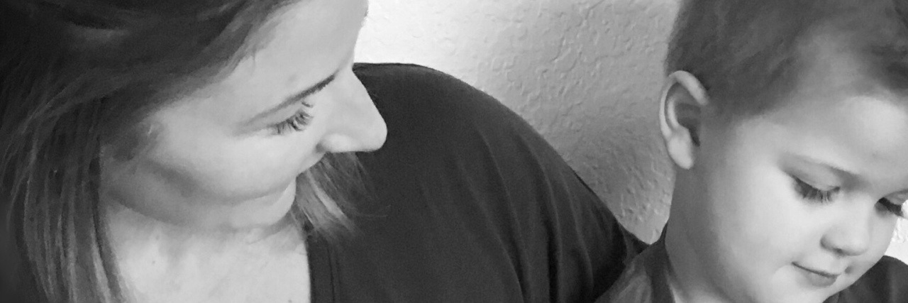 I Would Not Change My Son on the Autism Spectrum for the World mom holding son with autism