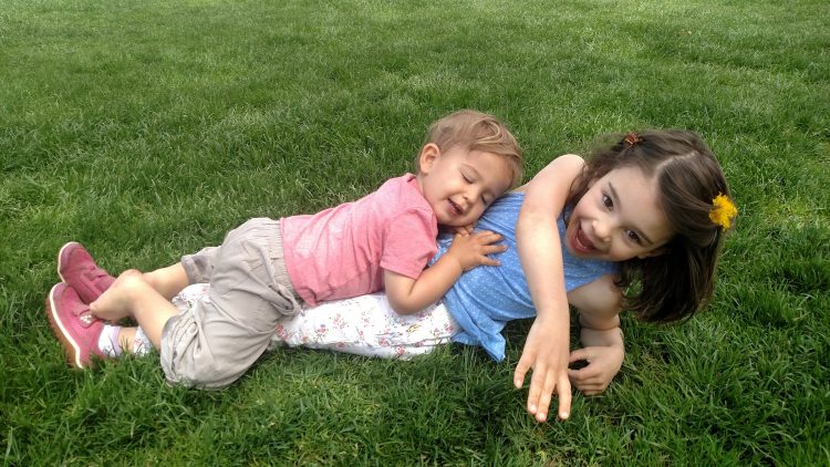 The author's children playing together outside