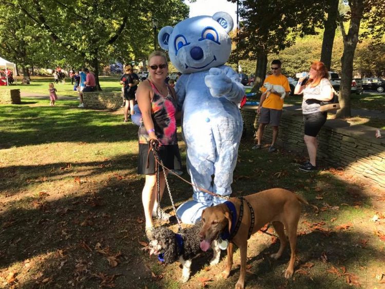 Camilla with her dogs in the park