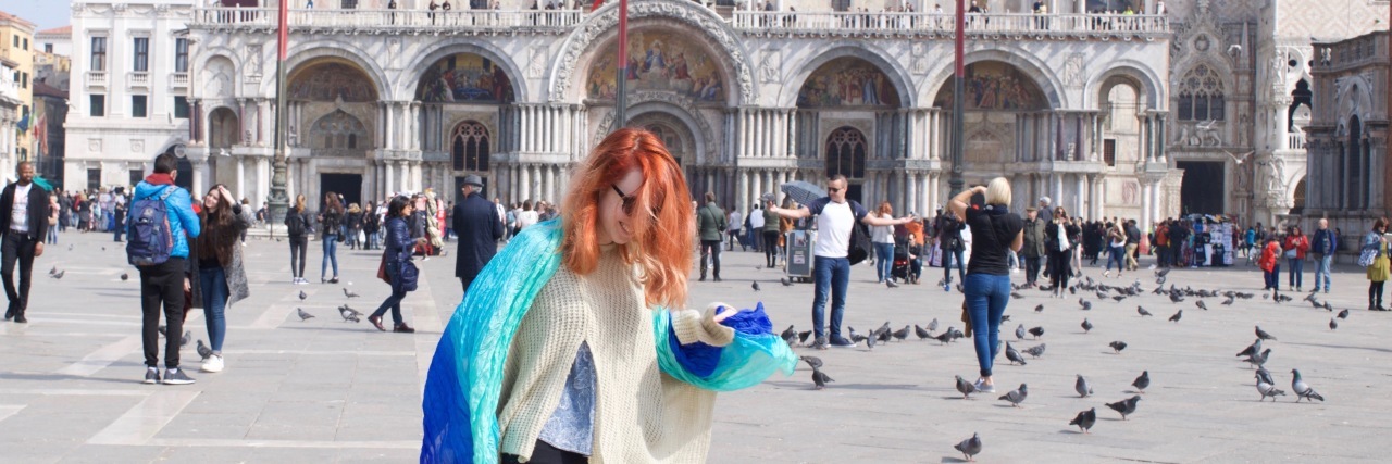 Being Diagnosed With Crohn's Disease Is Not a Life Sentence woman with red hair standing in front of a historic building