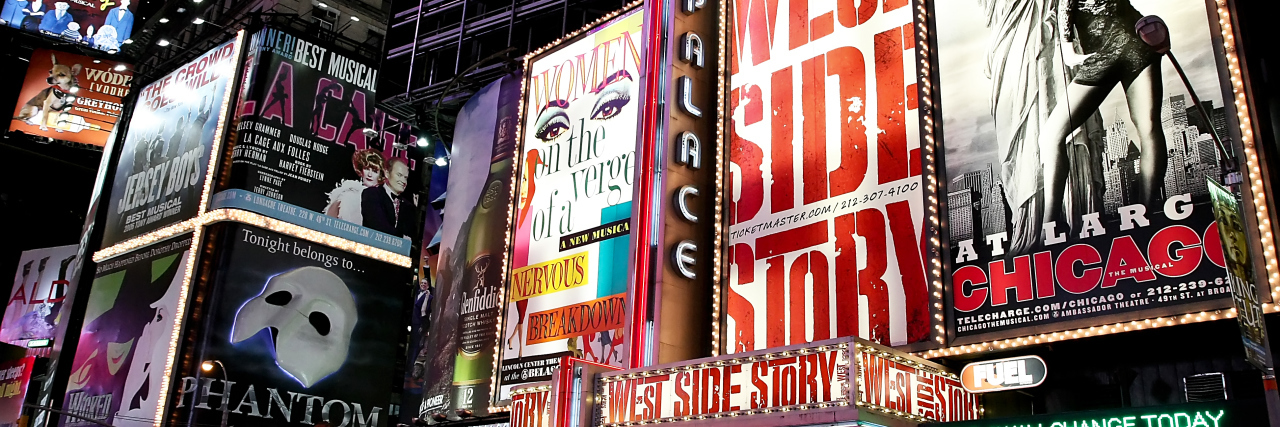 5 Showtunes I Relate to as an Autistic Person Broadway theater billboards in Times Square.