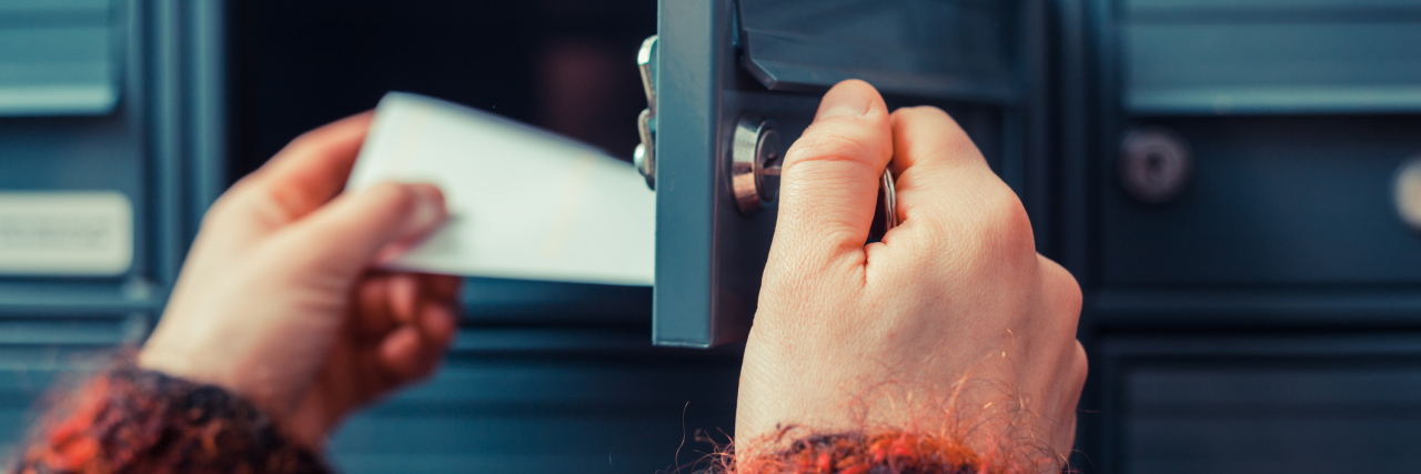 Dealing With Medical or Health-Related Phone Calls and Mail woman pulling a letter out of her mailbox