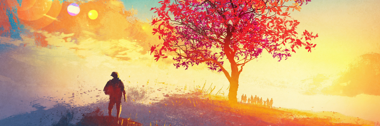 Schizophrenia Changed My Path, but I’m Still Working Towards My Goals A man looking at a tree