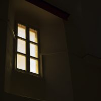Dark room, light from a window.