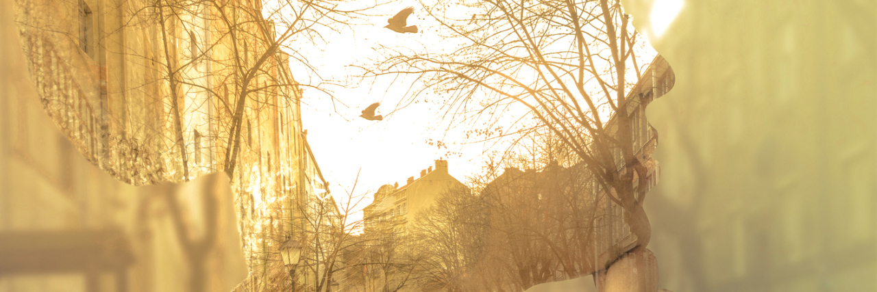 double exposure of a woman thinking and a street with birds flying around at sunset