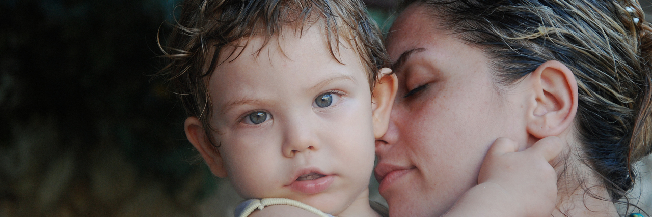 When the Energy of a Toddler and Rheumatoid Arthritis Don't Match A mother holding her young son.
