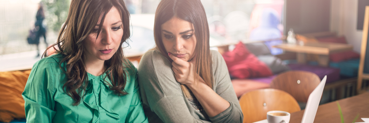 You're Not Getting an Accurate Answer When You Ask Me, 'How Are You?' Two women working together at a computer.