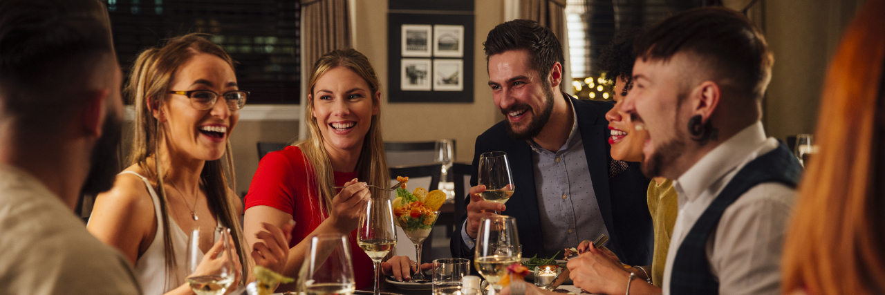 Making Friends as an Autistic Woman Group of friends enjoying a meal together.
