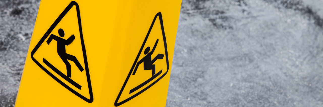 What I've Learned 15 Years After Losing My Balance Forever Caution wet floor, yellow warning sign.